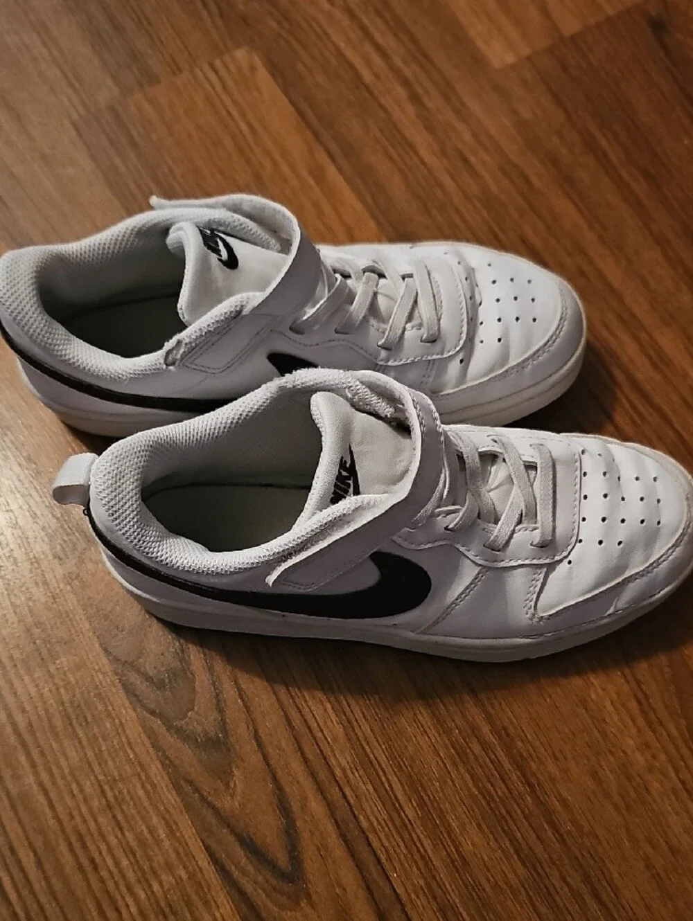 Nike Kids White Sneakers with Black Swoosh